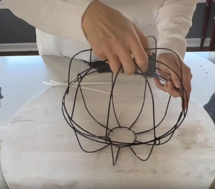 Two wire baskets secured together for creating the frame of the orb lights