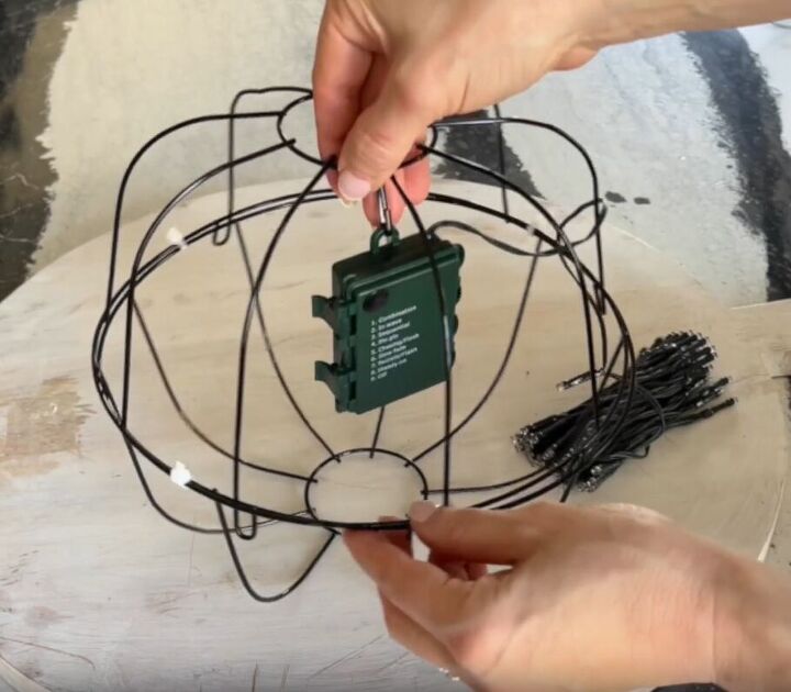 Battery box securely attached inside the wire basket globe