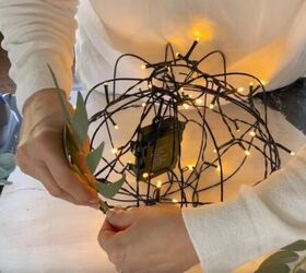 Leafy garland being attached to the orb light