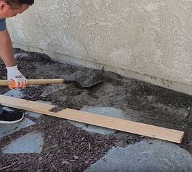 Digging out sandy soil to create a sturdy foundation for your garden craft