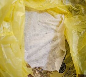 The brilliant reason everyone should lay a damp paper towel in their trash cans