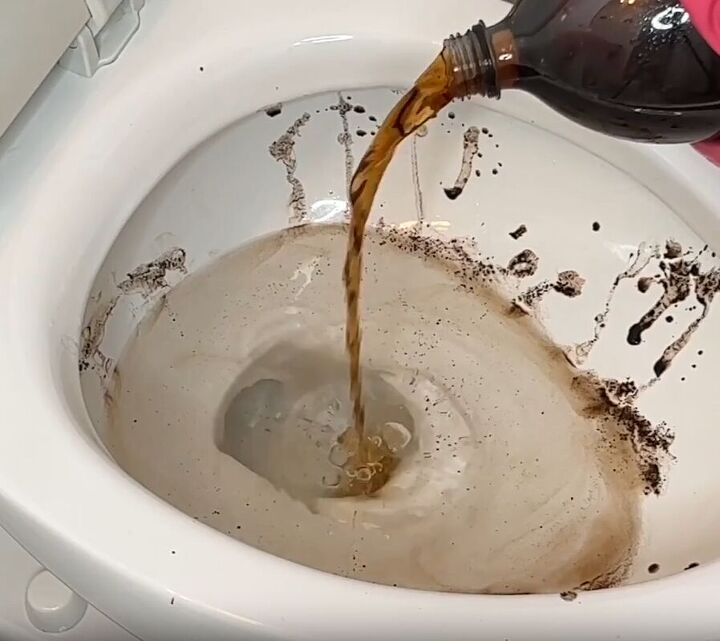 toilet cleaning hacks, A toilet bowl being filled with cola product