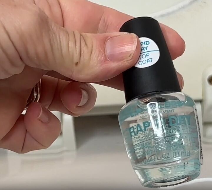toilet cleaning hacks, Apply clear nail polish to seal toilet screws