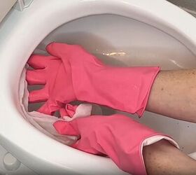 toilet cleaning hacks, Place vinegar soaked paper towel under the toilet rim