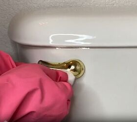 toilet cleaning hacks, Polish the toilet handle with baby oil