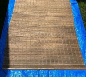 She spreads paint on her weathered and worn blinds for an amazing outdoor update