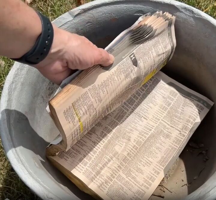 Old paper books can take up space at the bottom of a large plant pot