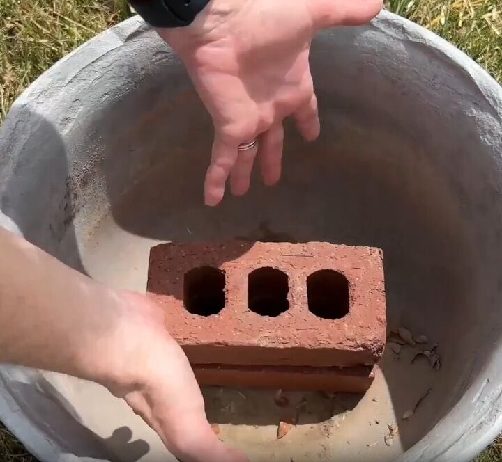 Bricks and rocks act as a filler and give support to a big planter