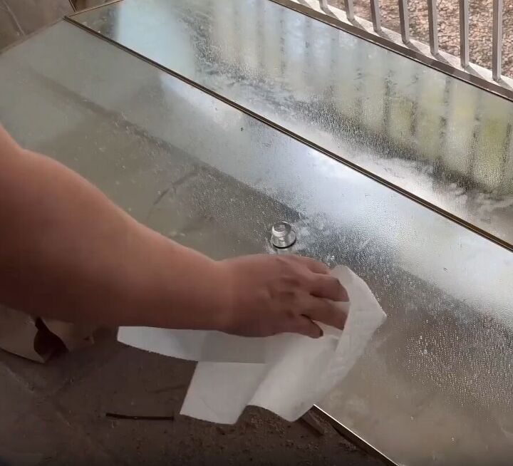 Thoroughly cleaning the mirrored surface of the door