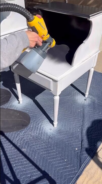 nightstand makeover, Spraying the nightstand with black paint