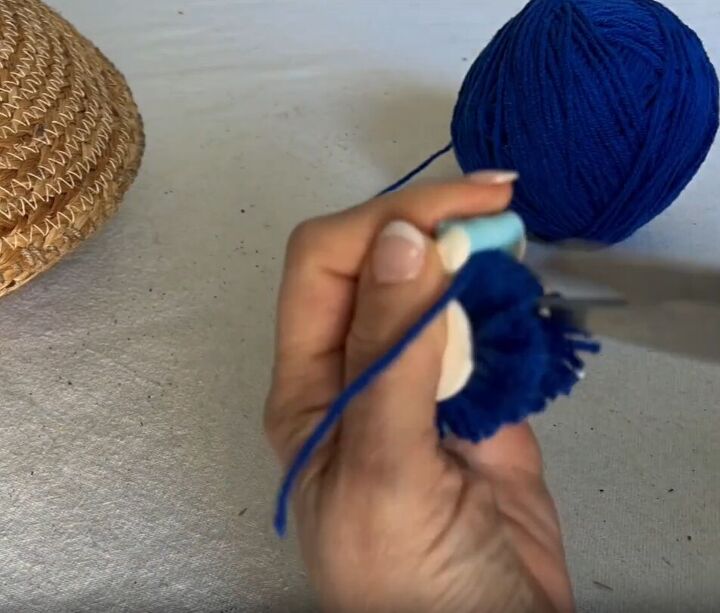 Use a pom-pom maker to create eight to ten pom-poms