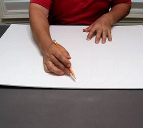 Drawing the pumpkin design in pencil on foam board