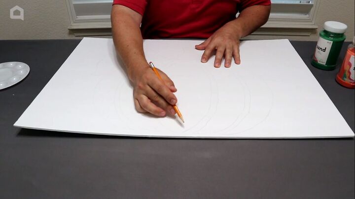 Drawing the pumpkin design in pencil on foam board