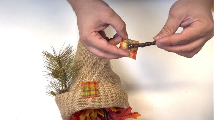 Gluing ribbon patches to the gnome's hat