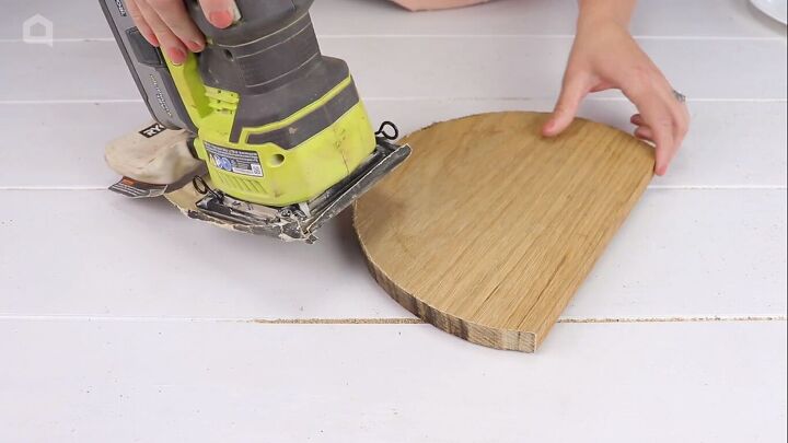 Sanding the edges of the wood piece