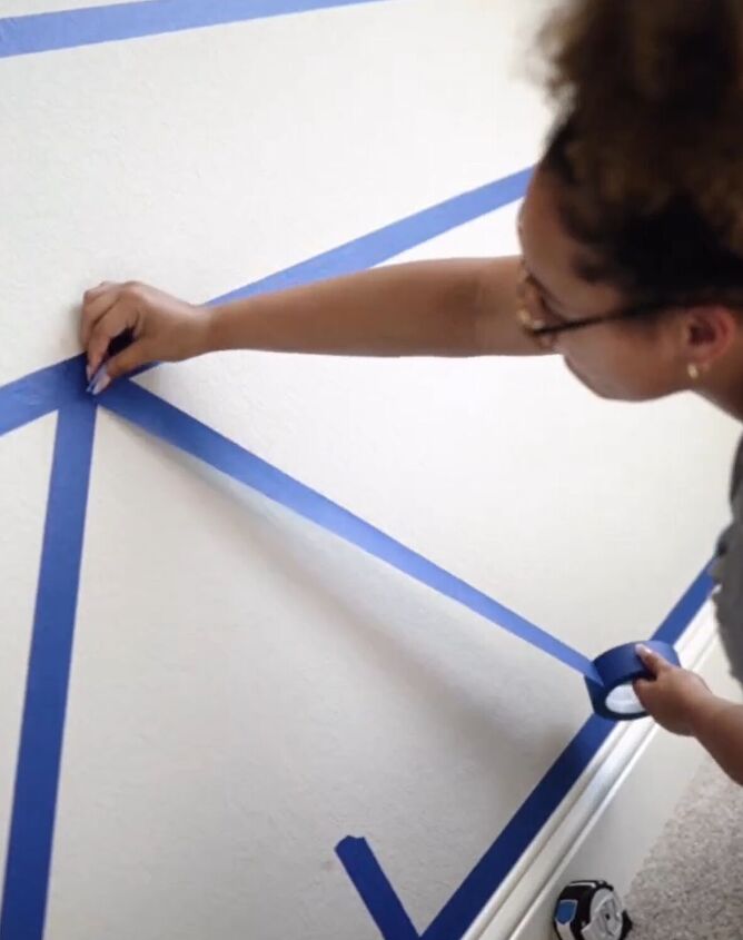 Applying painter's tape to the geometric pattern