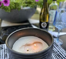 ideas sencillas y fciles para plantar orqudeas en casa, Una vela de citronela de exterior que se ha quemado hacia el fondo del recipiente