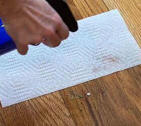 floor cleaning hacks, Spray paper towel with water