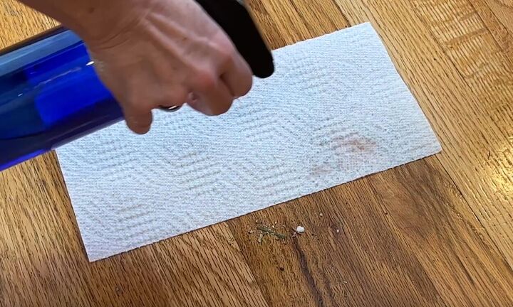 floor cleaning hacks, Spray paper towel with water