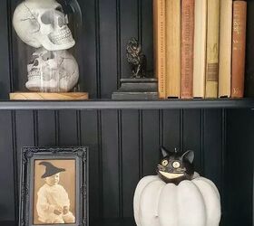 Halloween decor including a vintage portrait with witch hat