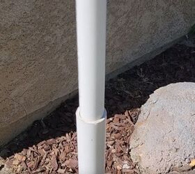 Slot the smaller PVC pipe into the larger one
