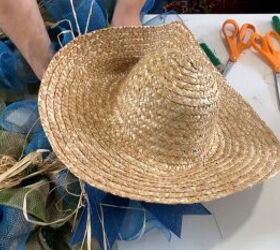Attaching the straw hat to the wreath