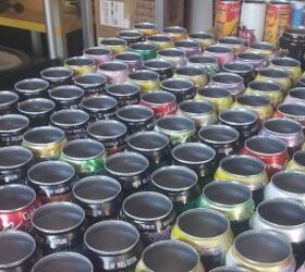 She cuts up soda cans, flattens them, and then uses them on her cabinet for THIS