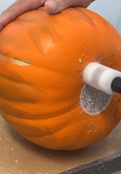 Drill the bottom of the pumpkins