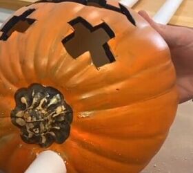 Insert the pvc pipes into the drilled holes in the pumpkins.