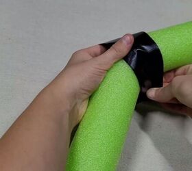 Bending the pool noodle and taping it