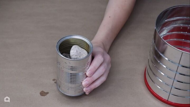 Adding rocks to the smaller can