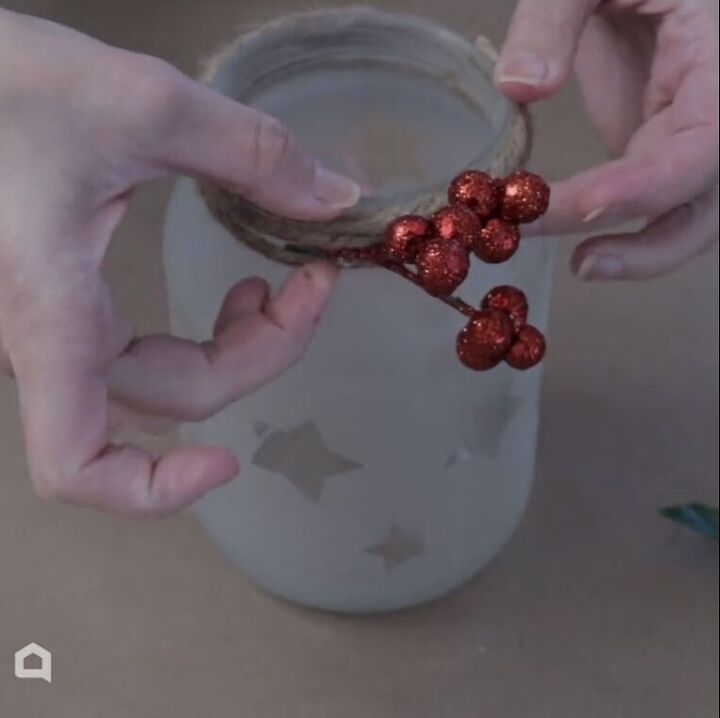 Gluing red berries to the jam rim