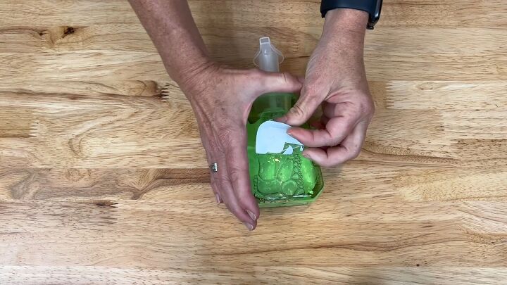 Remove the sticker from a bottle of handwash