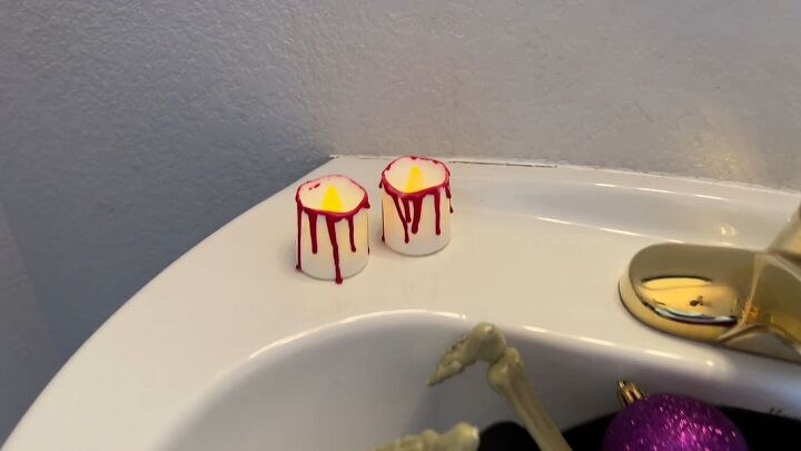 Creating wax dripped Halloween candle decor