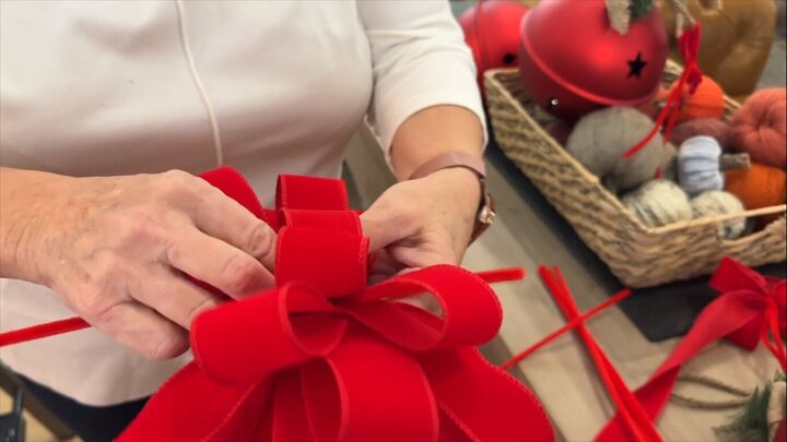 Making a big red bow with red velvet ribbon