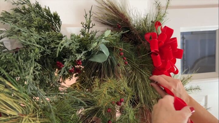 Attaching the bow to the garland