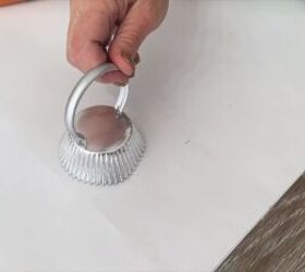 Gluing the shower curtain ring to the cupcake liner