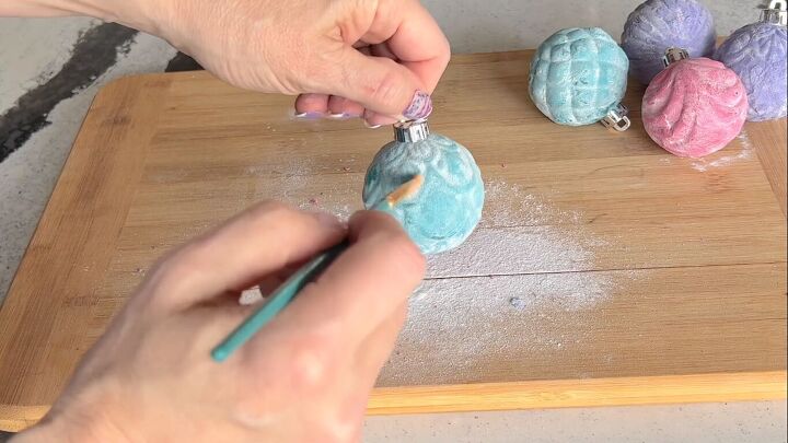 Dusting of the excess flour and baking soda with a paintbrush