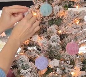 Hanging DIY flocked ornaments on a Christmas tree