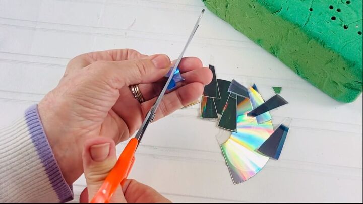 Cutting the DVD into tiny pieces