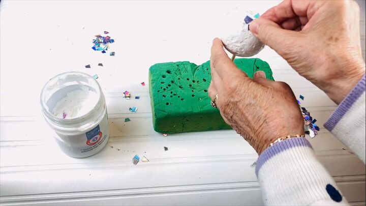 Placing the DVD pieces on the ball