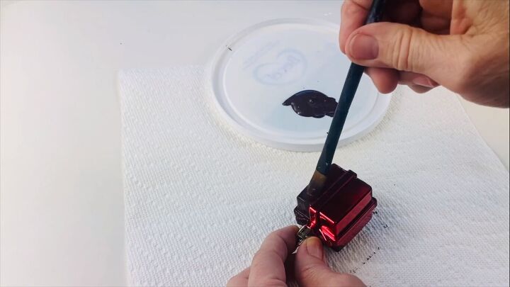 Painting the Christmas gift ornament black