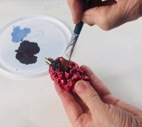 Painting the top of the pine cone ornament