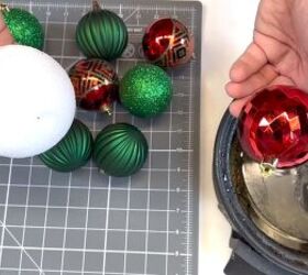 Applying hot glue to the ornament
