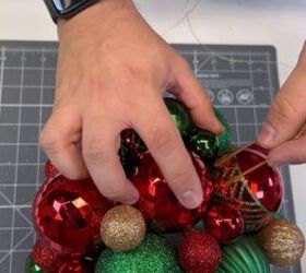 Sticking the hook into the ornament ball