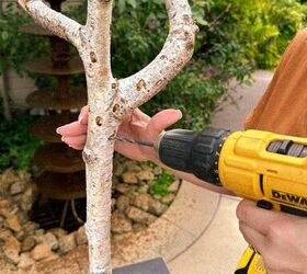 cmo hacer un impresionante rbol de otoo de imitacin diy que parece real, Una mujer taladrando agujeros en una rama de abedul en ngulo