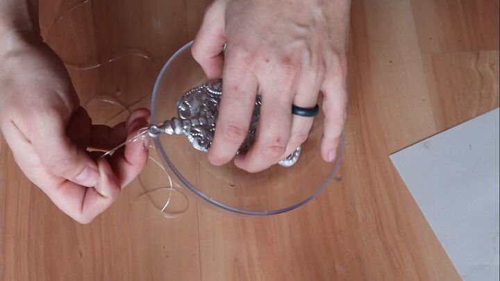 Tying the clear thread on the bell