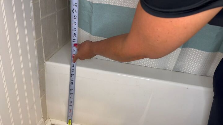 Measure the height of the tub