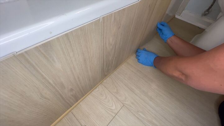 Install vinyl plank along tub surround