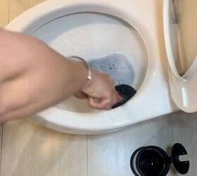 Using a toilet bowl scrubber